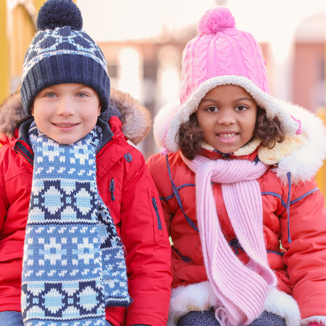 Two smiling kids wearing hats and scarves outside - Before and After School at Teston Village PS