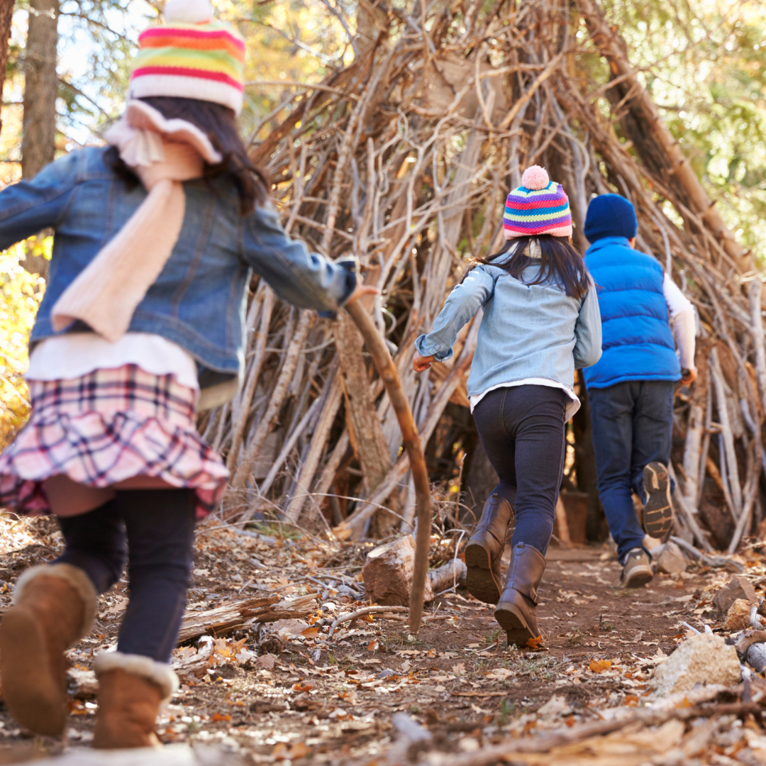 Children playing outside in fort in autumn - Before and After School at Wismer PS