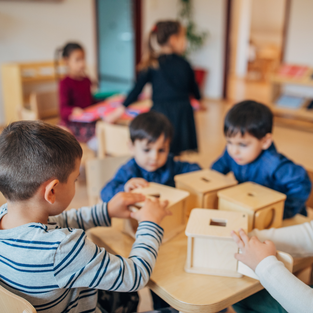 Kids inside classroom doing activity at table