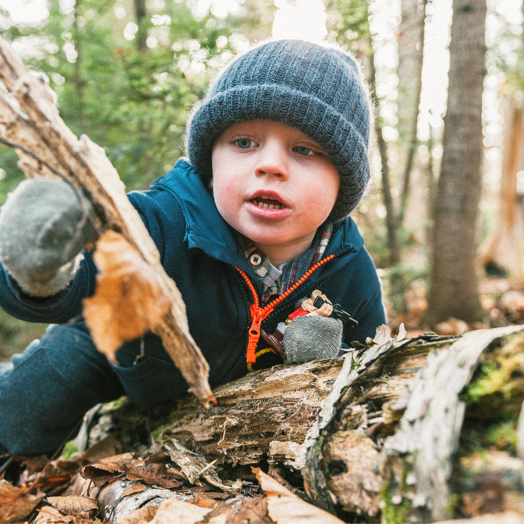 Child playing outside in nature