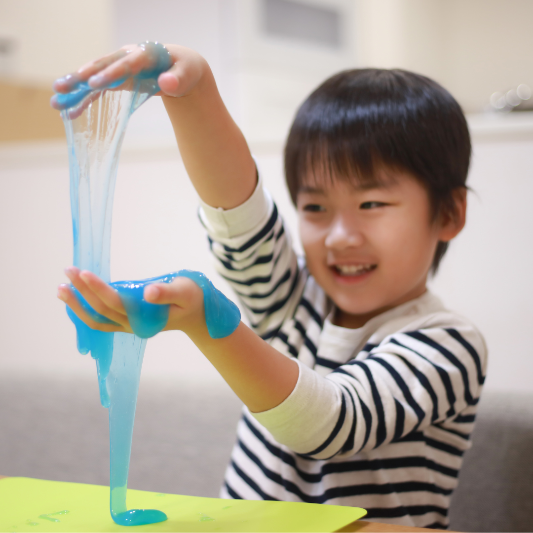 Kid playing with slime - Before and After School at Tosorontio Central PS