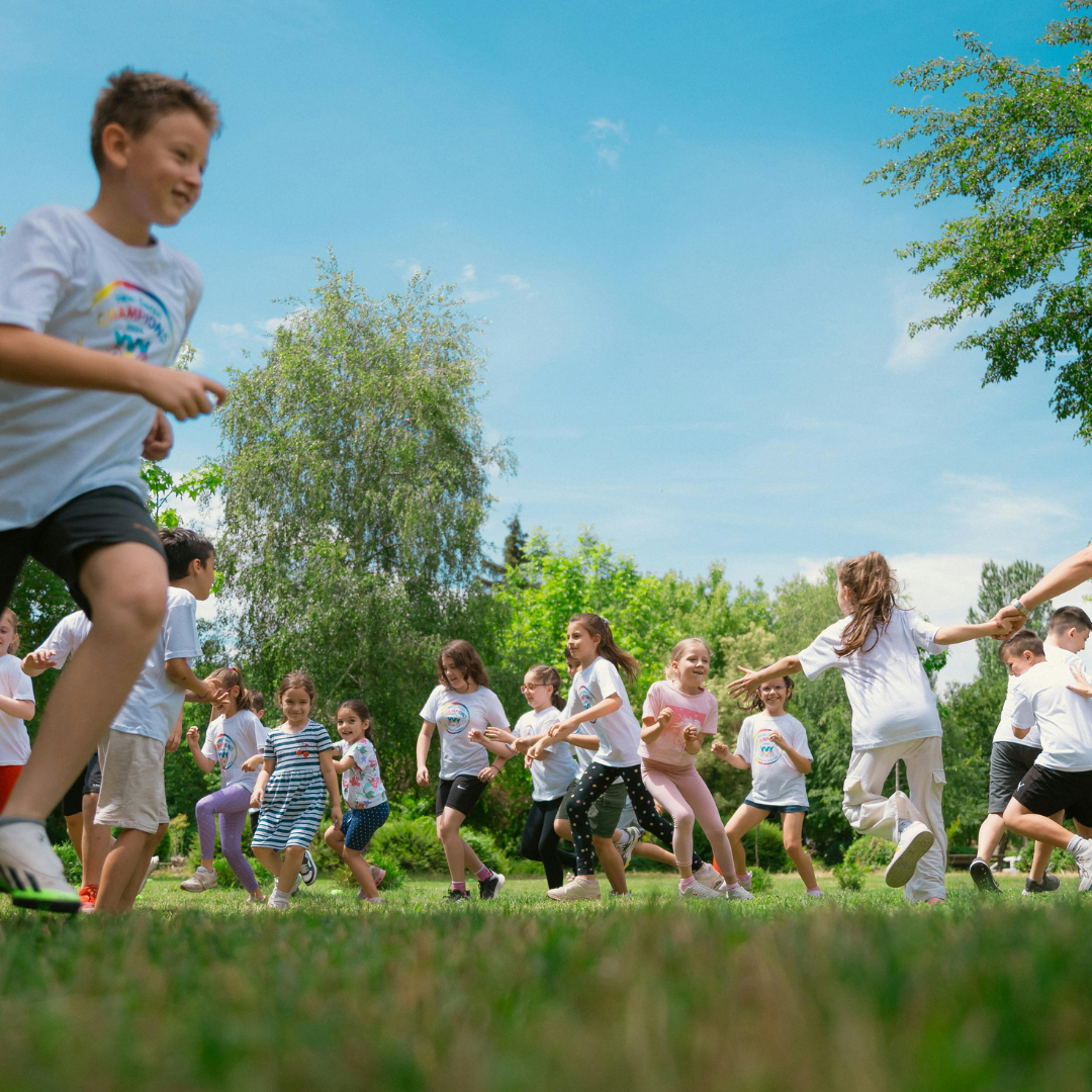 Children running around outside on grass - Before and After School at Wendat Village PS