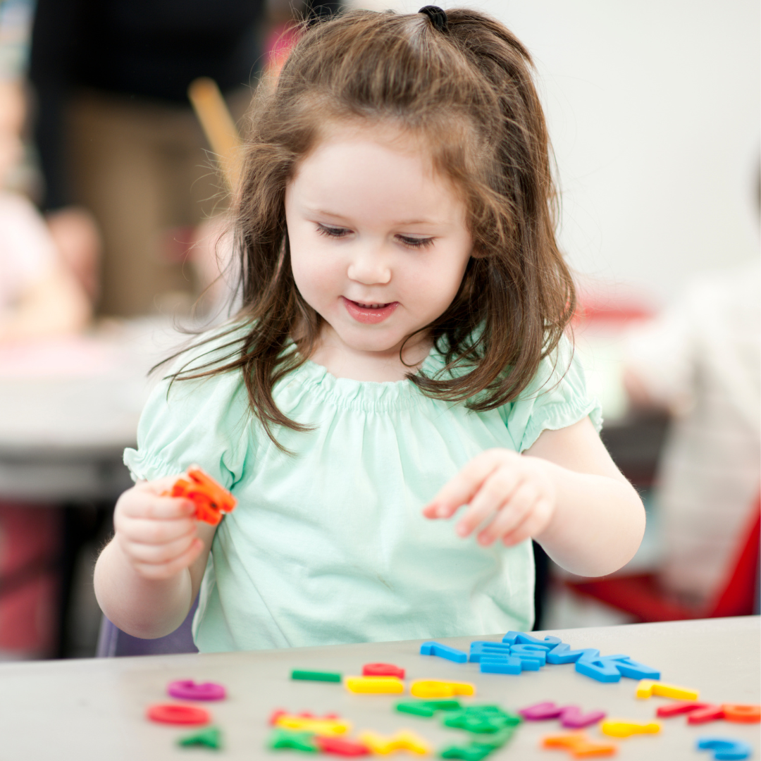 Young child doing table activities
