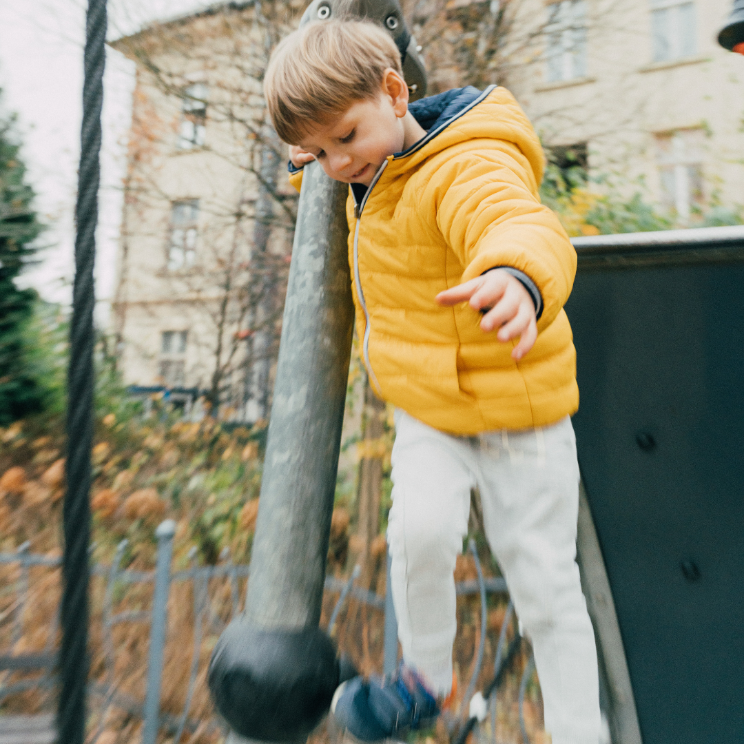 Child outside on a fall day - Before and After School at Rick Hansen PS