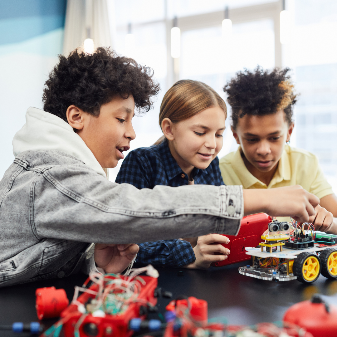 School age kids playing with remote control cars