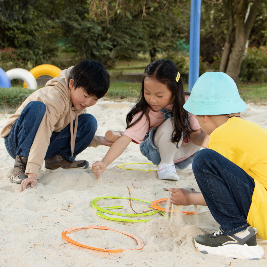 Kids doing activities outside on sand