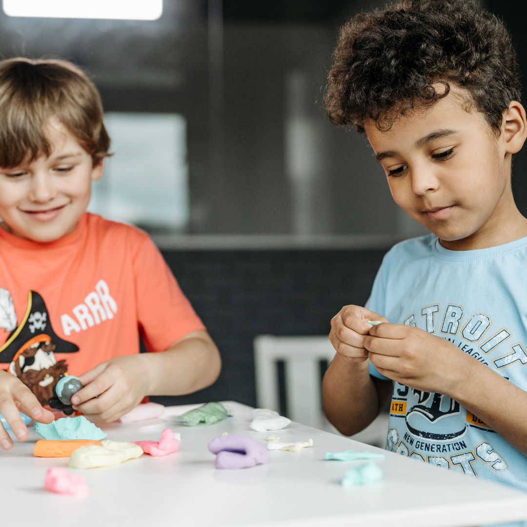Two children doing table activities - Before and After School at Rick Hansen PS