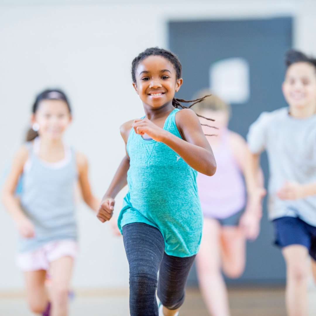 School age children running inside