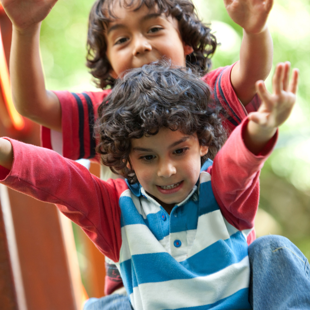 Two children on slide