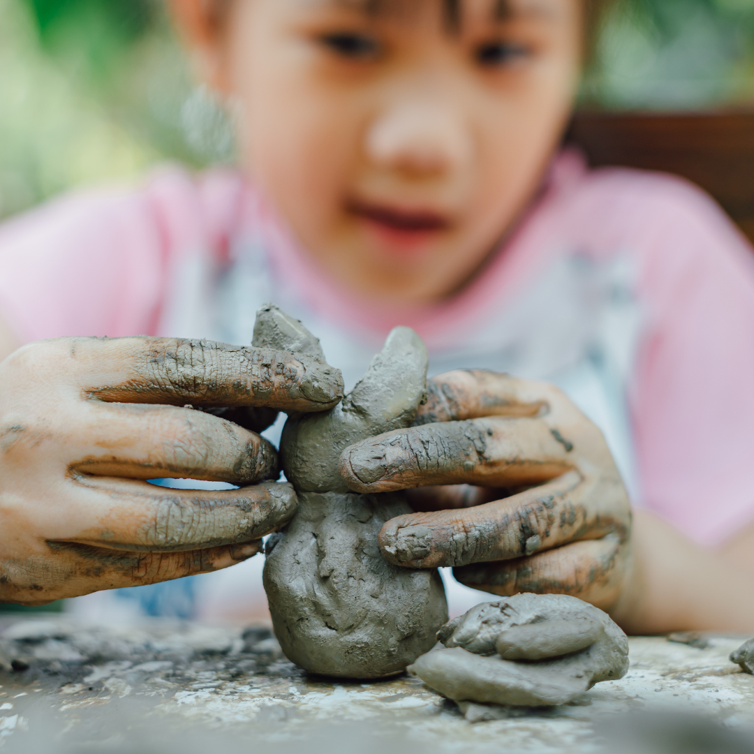 Child doing clay art activity