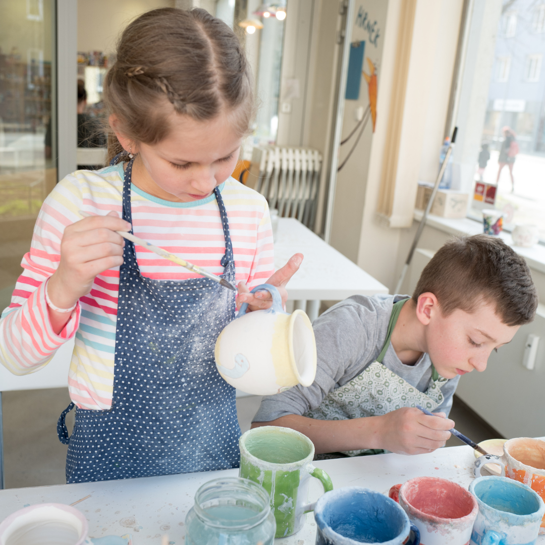 Children doing painting activity inside