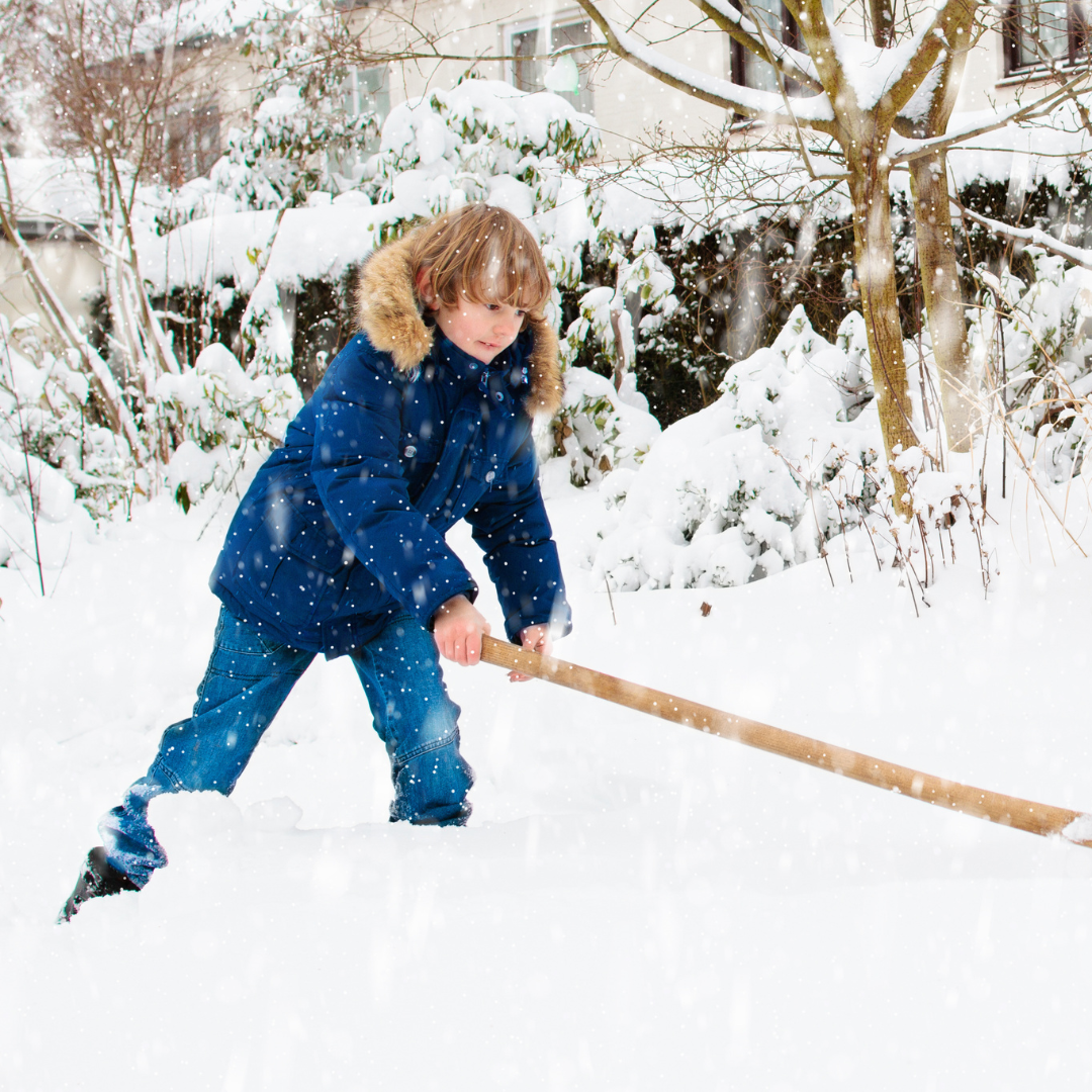 School age kid playing in the snow