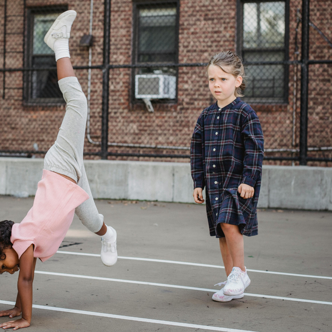 Kids playing and doing cartwheel on Before and After School at Tosorontio Central PS