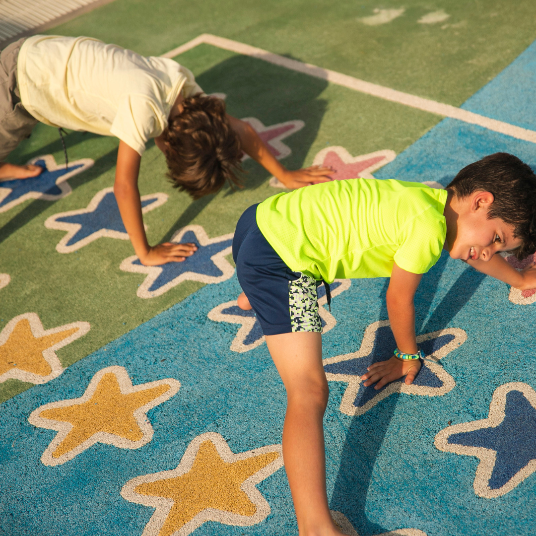 Kids stretching on floor mat - Before and After School at Fred Varley PS