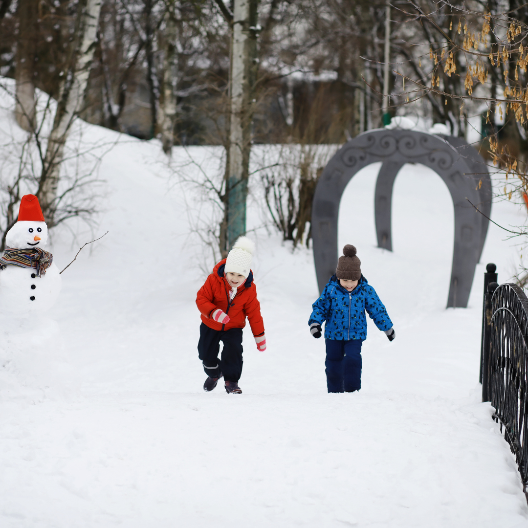 Children walking outside in snow