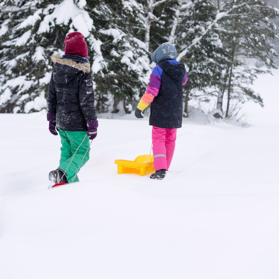 Kids standing with sled in snow - Before and After School at Warnica PS