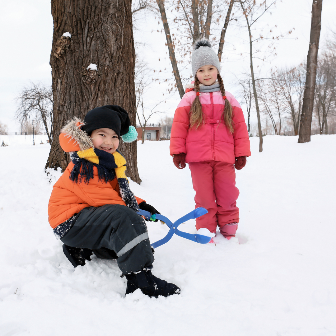 Kids playing outside in winter - Before and After School at Wellington PS