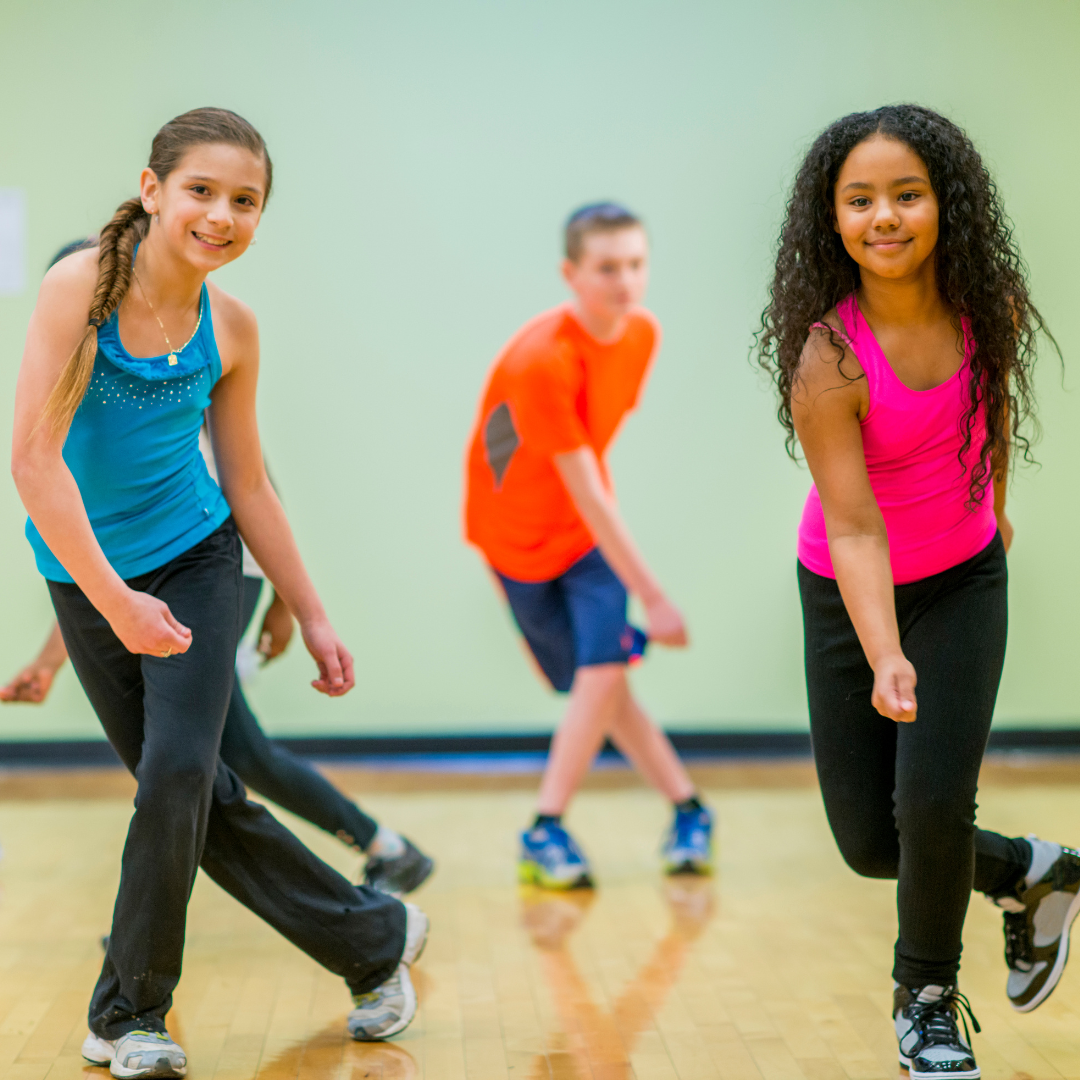 School age kids dancing in gym
