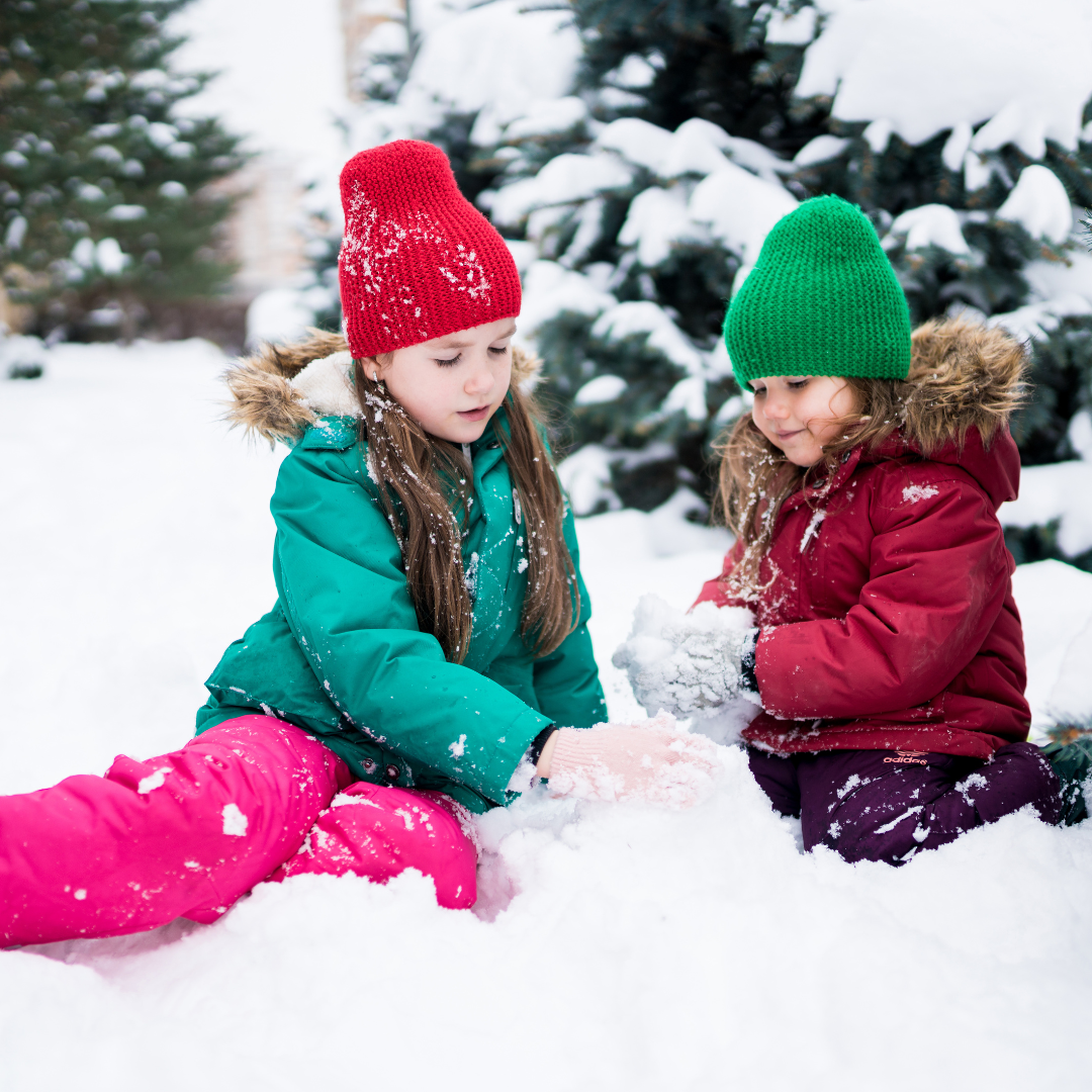 Two kids playing in snow