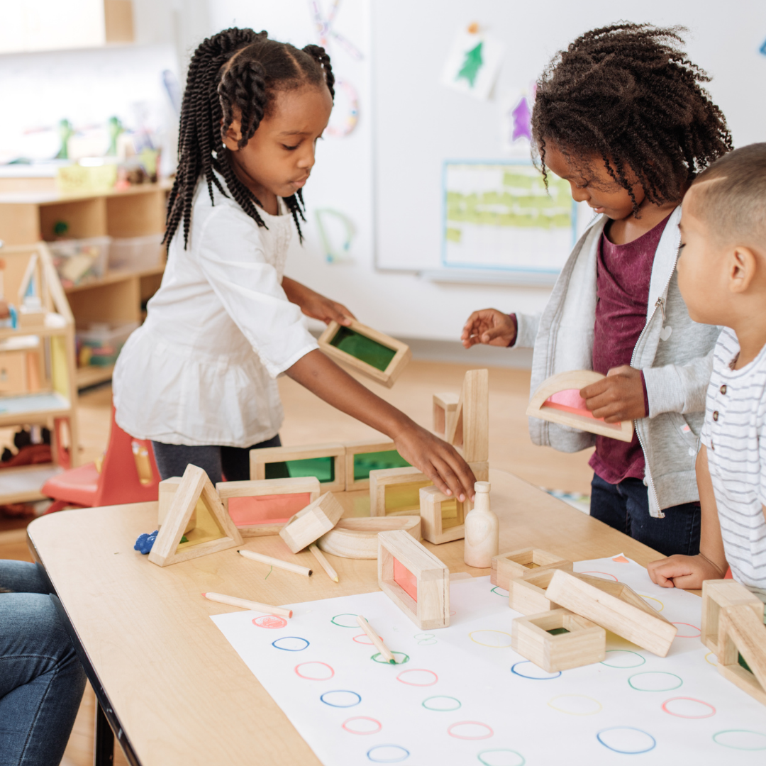 Children playing with blocks inside at classroom table - Before and After School at Clearmeadow PS