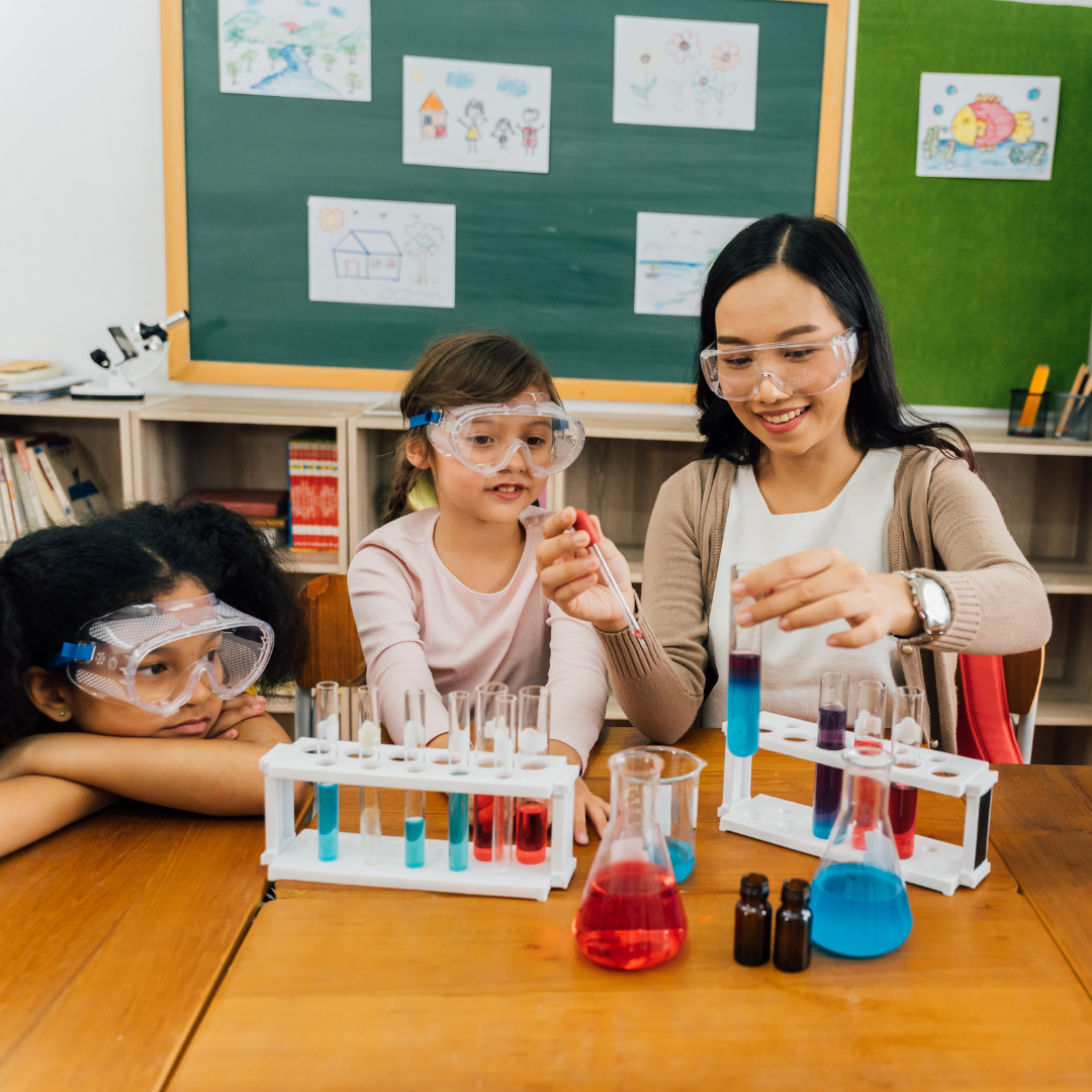 School age and educator wearing goggles for science activity - Before and After School at Assikinack PS