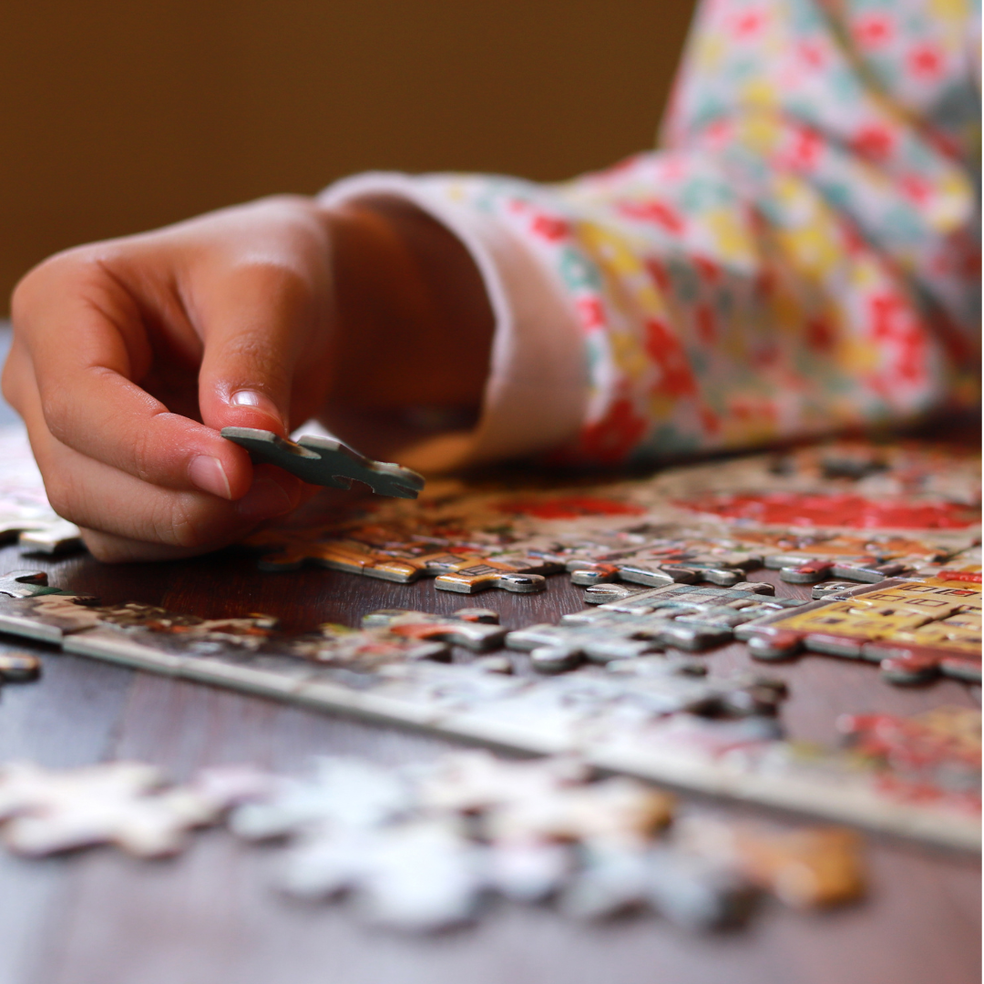 Kid doing puzzle - Before and After School at Wellington PS