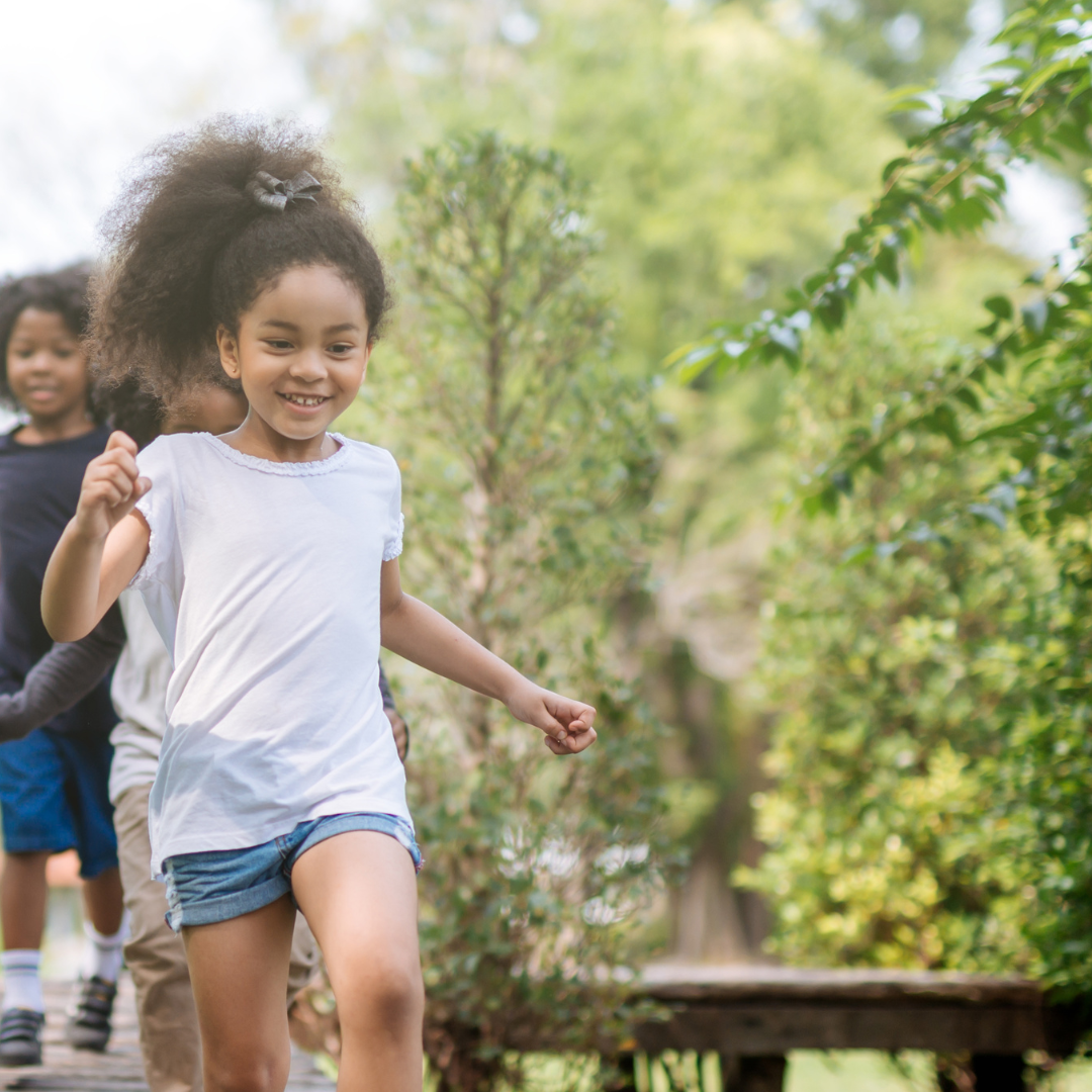 Children running outside in summer