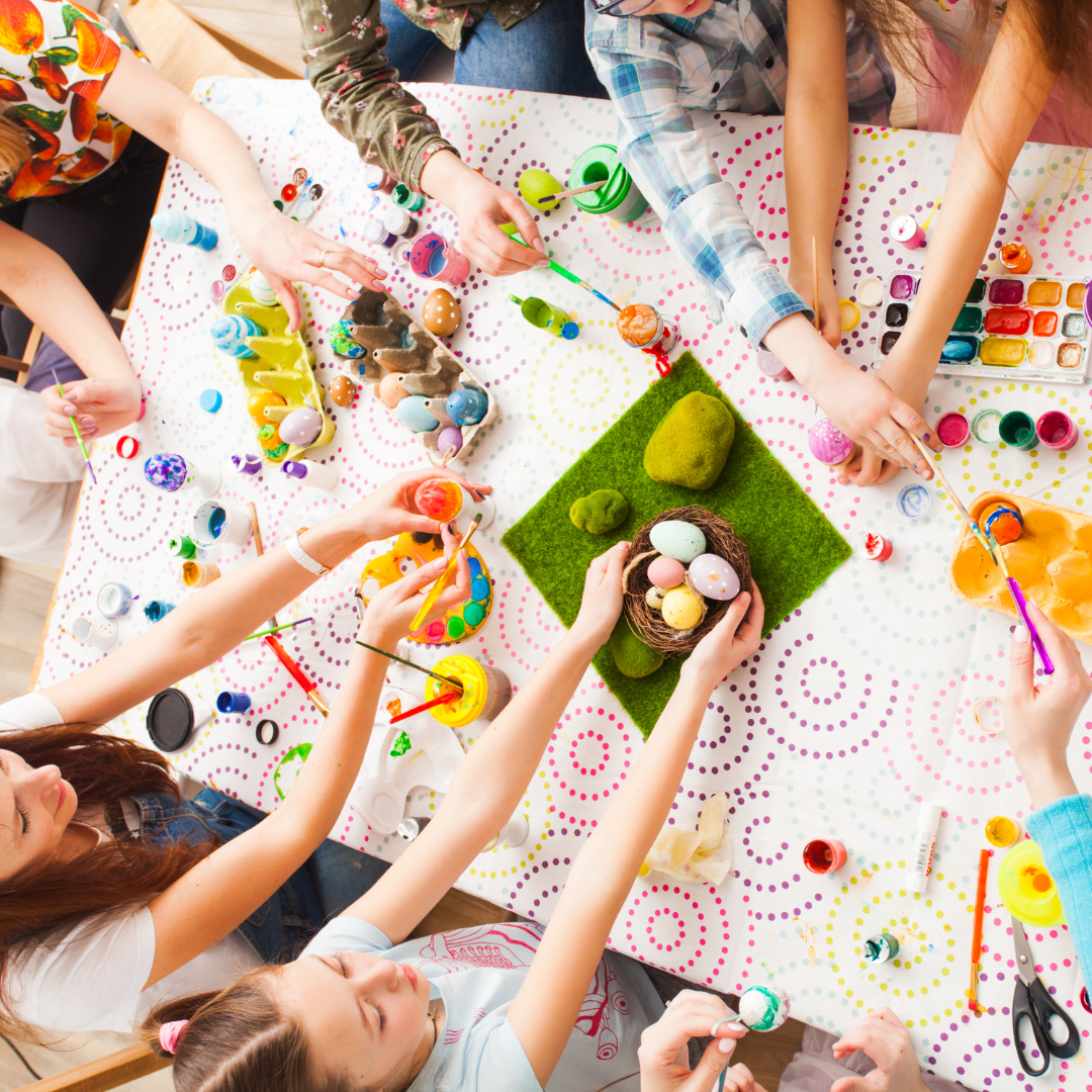 Birds eye view of children doing art at a table