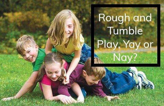 Rough and Tumble Play, Ya or Nay? Four smiling children piled on top of each other outside on the grass