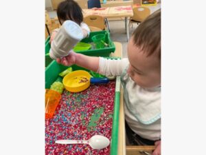 Toddler at sensory table