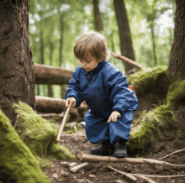 Young child playing with twigs in forest