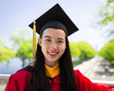 A graduate wearing cap and gown