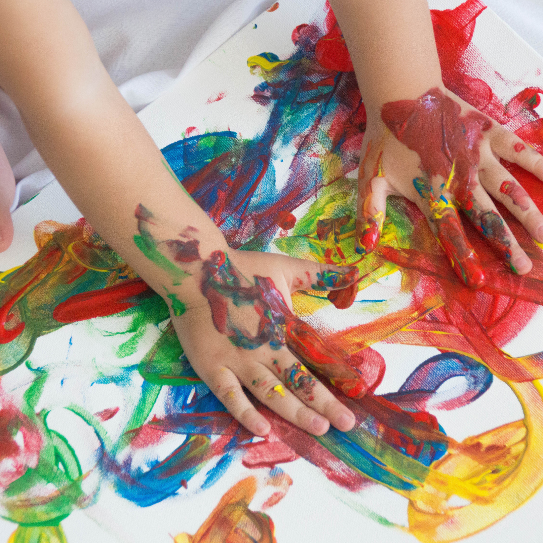 Child doing a finger painting