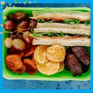 Back to school prep - lunch box with sandwich and fruits