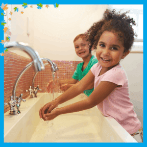 Back to school prep - two young children washing hands at sink