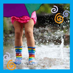 Repeat play - Kid with umbrella in rubber boots splashing in rain
