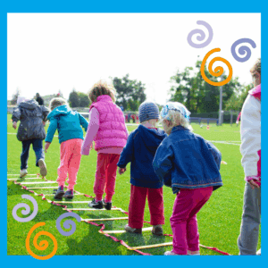 Repeat play - young children teambuilding jumping activity on green grass