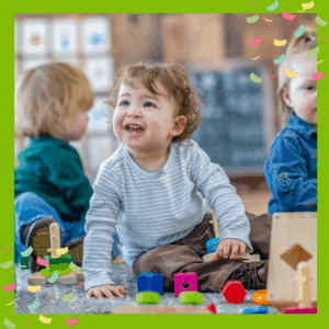 Toddlers doing parallel play with toys