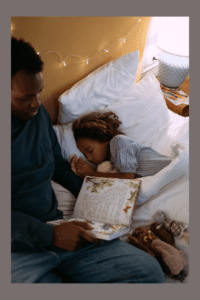 Father reading bedtime story.